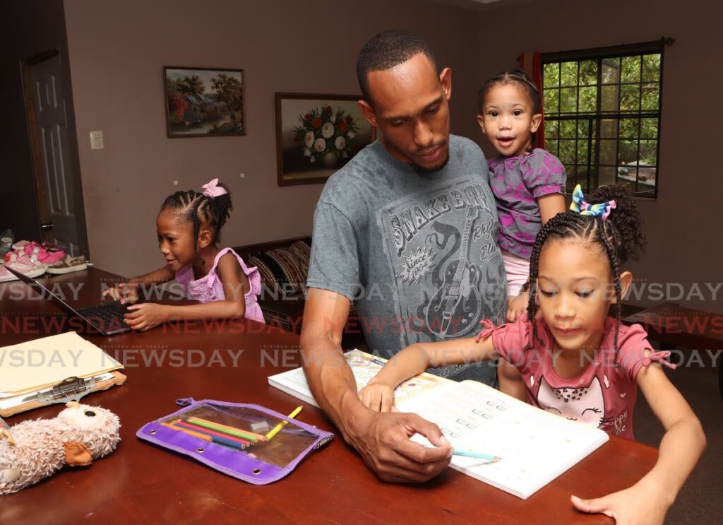 Maurice David home schools his daughters from left, seven year old Yeva, Xola, three, and Zara, eight.  - Angelo Marcelle