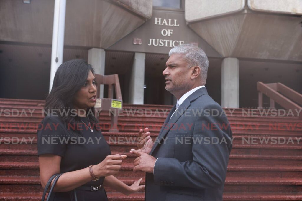 Auditor General Jaiwantie Ramdass, left, talks to her attorney Anand Ramlogan, SC, outside the Hall of Justice, Port of Spain on June 17.  - Photo by Jeff K Mayers