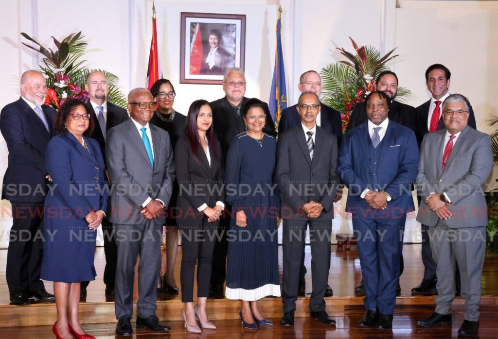 President Christine Kangaloo (centre) with 13 attorneys who were appointed to the rank of Senior Counsel at President's House, Port of Spain, on June 17. 
Front row from left: Annabelle Sooklal, Anthony Smart, Hasine Shaikh, Winston Seenath, Keith Scotland, Ravindra Nanga.
Back row from left: Mark Morgan, Lee Merry, Eliane Green, Gregory Delzin, Simon De La Bastide, Regan Asgarali, and Faris Al Rawi. - File photo by Roger Jacob