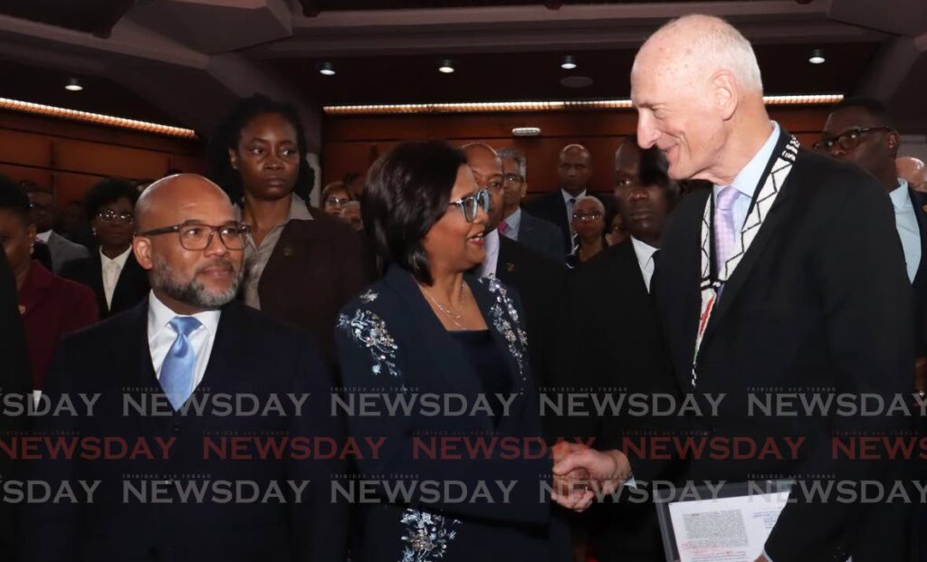 President Christine Kangaloo, centre, greets South African jurist Edwin Cameron as her husband attorney Kerwyn Garcia, SC, looks on at the Judicial Institute lecture series at the Convocation Hall, Hall of Justice on Knox Street, Port of Spain on June 18.  - Photo by Faith Ayoung