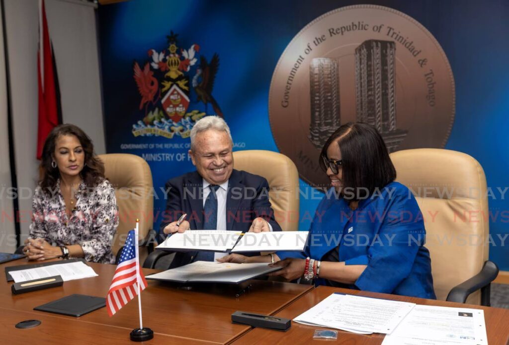 From left US Ambassador Candace Bond, Minister of Finance Colm Imbert and president and chair of the  Export-Import Bank of the United States (EXIM Bank) Reta Jo Lewis during an MoU signing to provide up to US$500 million in funding to TT at the ministry's Port of Spain office on June 18. - Photo by Jeff K Mayers