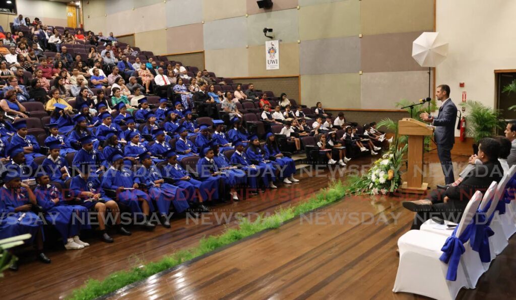 Three-time Olympian Andrew Lewis, right, speaks to the 2024 graduating class of the Specialist Learning Centre at its graduation and prize-giving ceremony at the Daaga Auditorium, UWI, St Augustine on June 18. - Photo by Roger Jacob