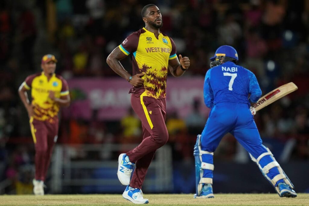 
West Indies' Obed McCoy celebrates after he bowled out Afghanistan's Mohammad Nabi during an ICC Men's T20 World Cup cricket match at Daren Sammy National Cricket Stadium in Gros Islet, Saint Lucia, on June 17, 2024.  - AP PHOTO