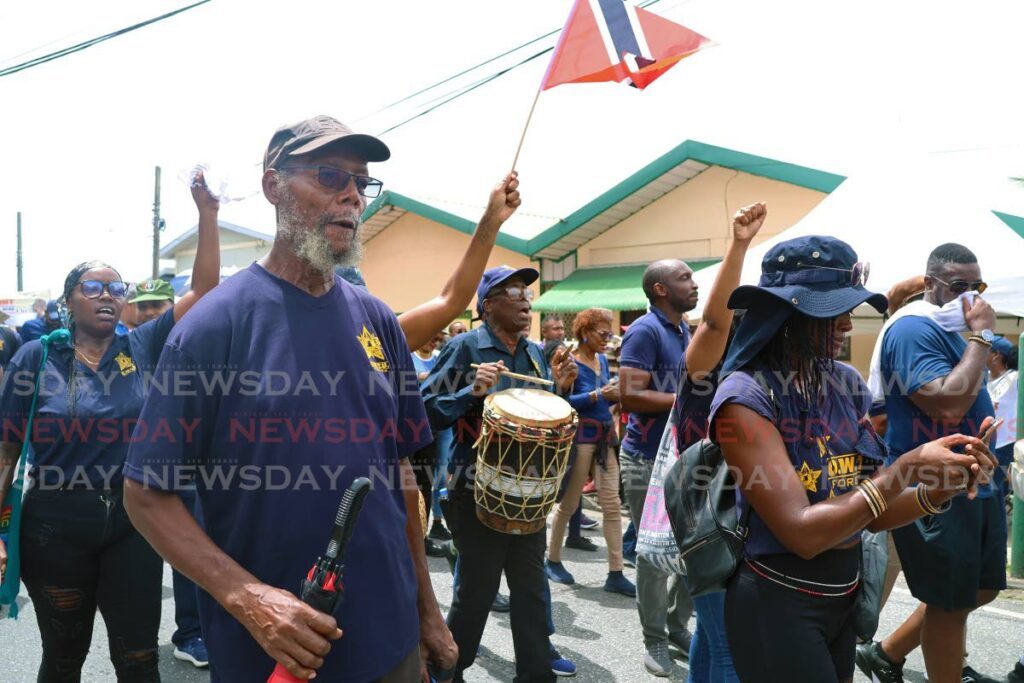 MARCHING ON: Members of the Oildfield Workers Trade Union march to Charlie King in Fyzabad during the annual Labour Day celebration on June 19.  - Photo by Venessa Mohammed