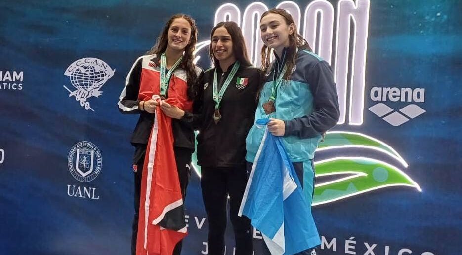 Isabella Dieffenthaller, left, after winning a silver medal for TT at the CCCAN Swimming Championships in Mexico. Photo courtesy Bertram Blackman. - Photo courtesy Bertram Blackman