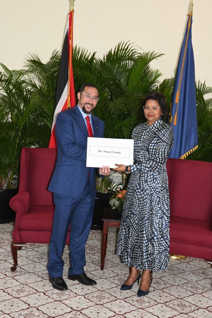 President Christine Kangaloo presents attorney Stuart Young with his instrument of appointment to Senior Counsel (SC) at a presentation ceremony at The President’s House on June 20. - 