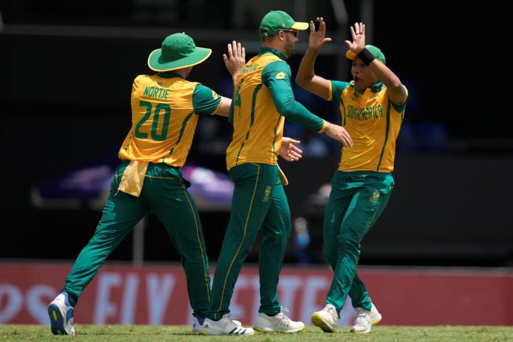 South Africa's Anrich Nortje, left, celebrates with teammates after taking the catch to dismiss England's Jonny Bairstow during the ICC Men's T20 World Cup match at Daren Sammy National Cricket Stadium in Gros Islet, Saint Lucia, June 21. - AP