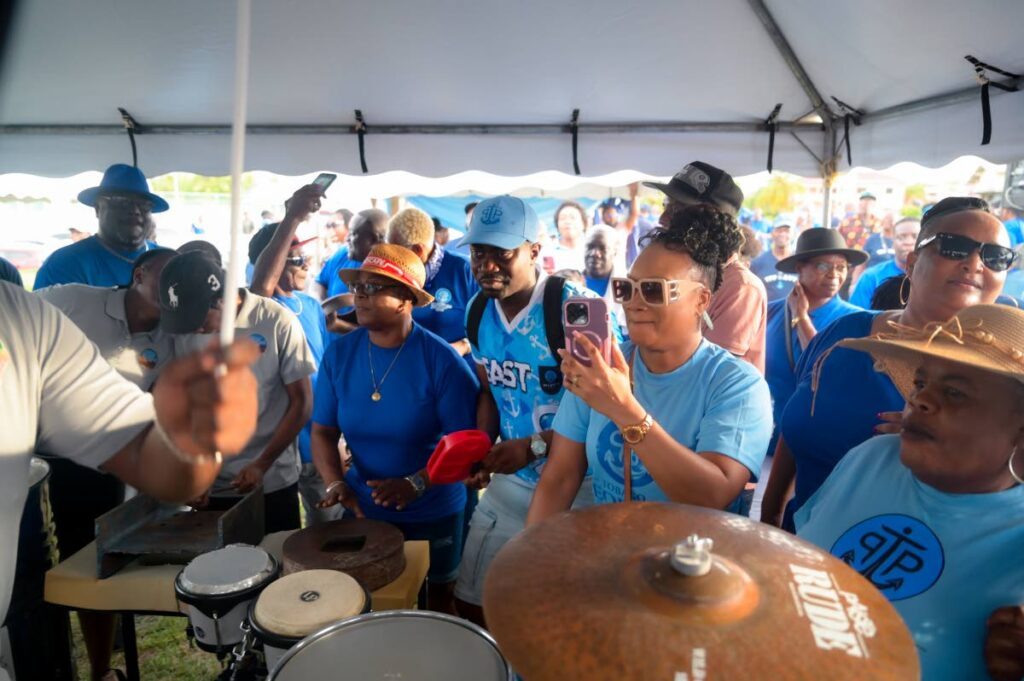 THA Chief Secretary Farley Augustine, centre, plays along with the rhythm section at the Tobago People's Party (TPP) sports and family day at the Montgomery Recreation Grounds on June 19. - Photo courtesy Visual Styles