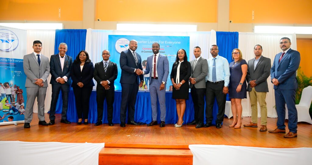 THA Chief Secretary Farley Augustine, centre, is greeted by Ministry of Digital Transformation permanent secretary Cory Belfon as ministry officials, TATT officials and other stakeholders look on at the launch of TATT's first largescale broadband service St John’s Parish, Tobago, under the Universal Service Fund at the Parlatuvier Multipurpose Facility on June 20. - Photo courtesy Visual Styles