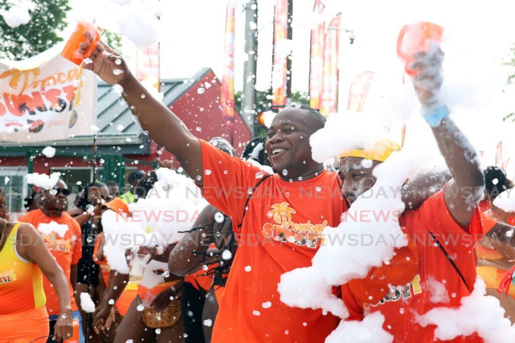 Just Illusions band members enjoy the festivities at the  Siparia J'Ouvert on June 22. - Photo by Venessa Mohammed