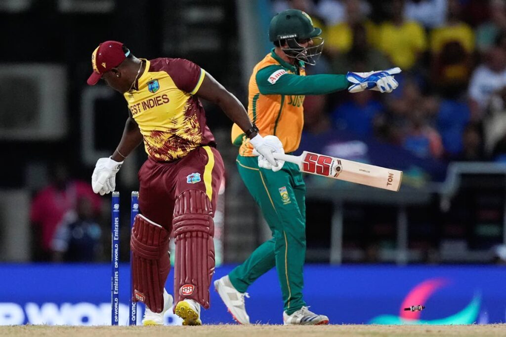 West Indies' Rovman Powell reacts after he was stumped by South Africa's Quinton de Kock during the ICC Men's T20 World Cup Super 8 match at Sir Vivian Richards Stadium in North Sound, Antigua and Barbuda, on June 23, 2024. - AP PHOTO