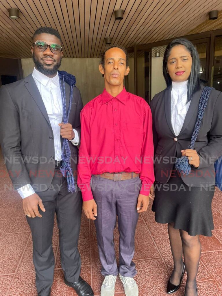 Williace Rodriguez and his attorneys Michelle Ali, right, and Markus Issacs at the Hall of Justice, Port of Spain, on June 21. - 