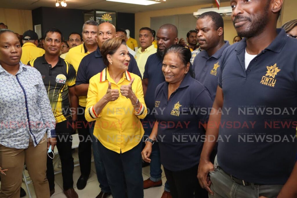 Opposition Leader Kamla Persad-Bssessar with OWTU members during a UNC cottage meeting at the party's headquarters at Mulchan Seuchan Road, Chaguanas, on Monday night. - Photo by Ayanna Kinsale 