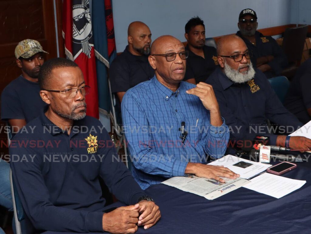 OWTU president general Ancel Roget, centre, addresses the media at OWTU headquarters, San Fernando, on June 25. - Angelo Marcelle