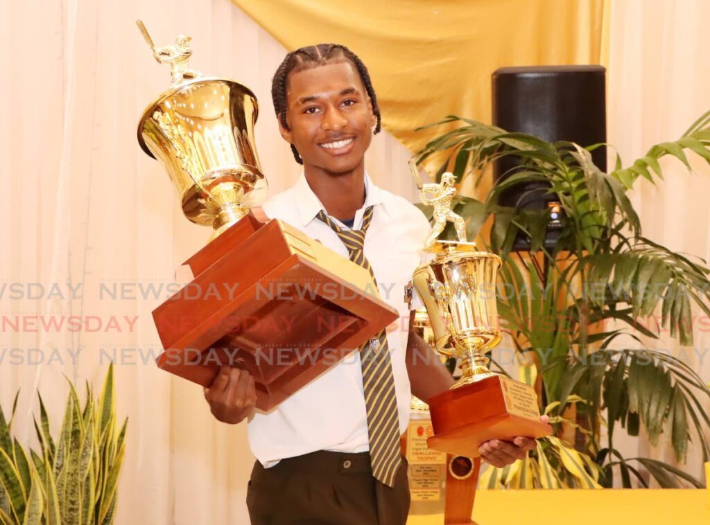 Presentation College San Fernnando's Jacen Agard smiles as he walks away with the trophies for the Boys' Intercol T20 competition during the Secondary Schools Cricket League awards and prize giving ceremony at Signature Hall, Chaguanas. - Photo by Ayanna Kinsale 