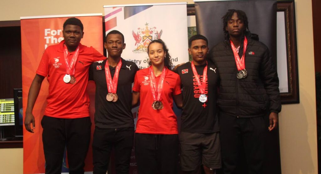 Trinidad and Tobago Junior Pan American Track Cycling Championships cyclists from left to right: Danell James, Jadian Neaves, Makaira Wallace, Syndel Samaroo and Jelani Nedd, at the Piarco International Airport on June 25. -  Photo courtesy Sports Company of TT (SporTT).  - 