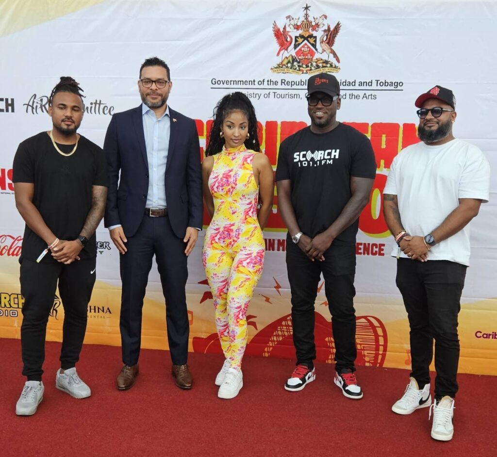 Tourism Minister Randall Mitchell, second from left, with Jamaica dancehall star Shenseea, centre, Air Committee executive Shane Baird, left, Scorch founder Kwesi Hopkinson, second from right, and Illusions Mas executive Damian Baboolal during the closing ceremony  of the  inaugural Caribbean Music Conference at NAPA which as part of the Soca and Dancehall Music Week. - Photo courtesy Overtime Media
