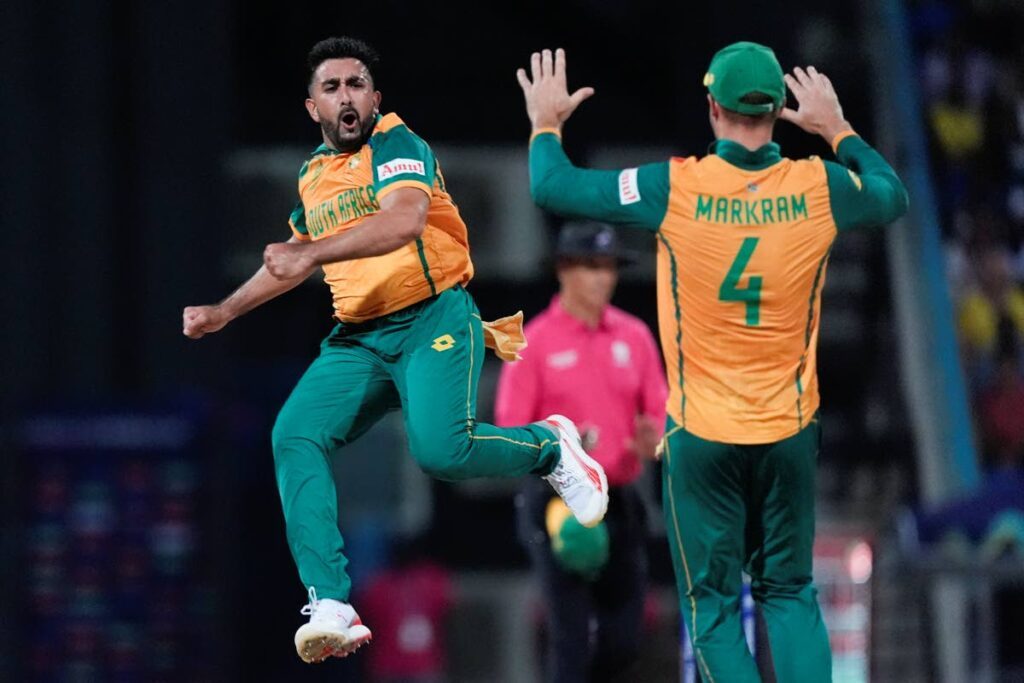 South Africa’s Tabraiz Shamsi, left, jumps to celebrate with teammate Aiden Markram after taking a wicket during the ICC Men’s T20 World Cup at Sir Vivian Richards Stadium in North Sound, Antigua, Sunday. - AP