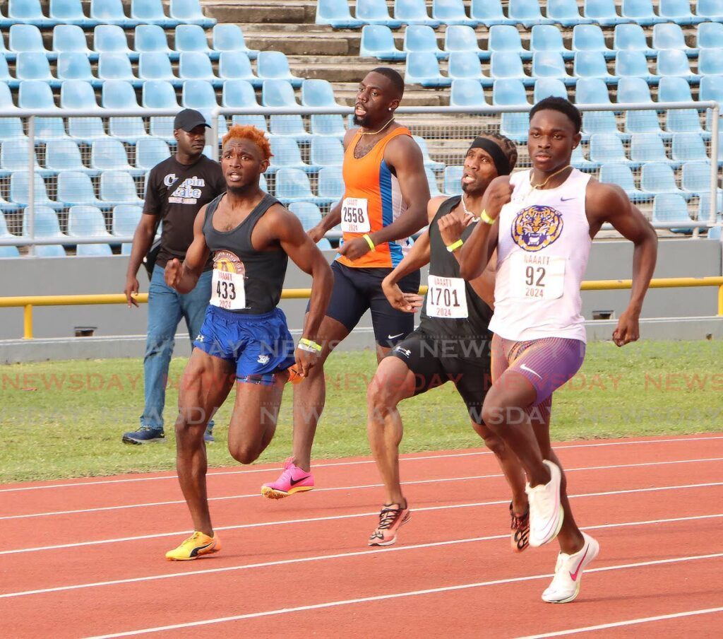 Shakeem McKay, right, on his way to victory as former national star Renny Quow, second from right, trails in the men's 400m heats at the NAAA Senior and Junior National Championships, at the Hasely Crawford Stadium, Mucurapo.  - Angelo Marcelle