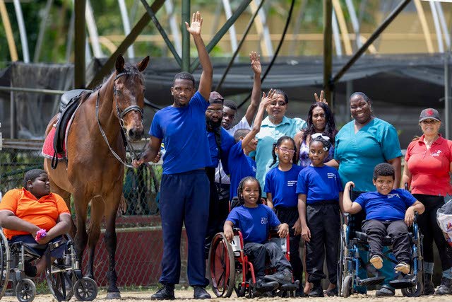 Students of the Princess Elizabeth School and organisers of the TT Equestrian Association (TTEA) attend the TTEA's 'Eqifun' morning on June 12 at the San Antonio Stables, Santa Cruz.  - Photo courtesy TTEA