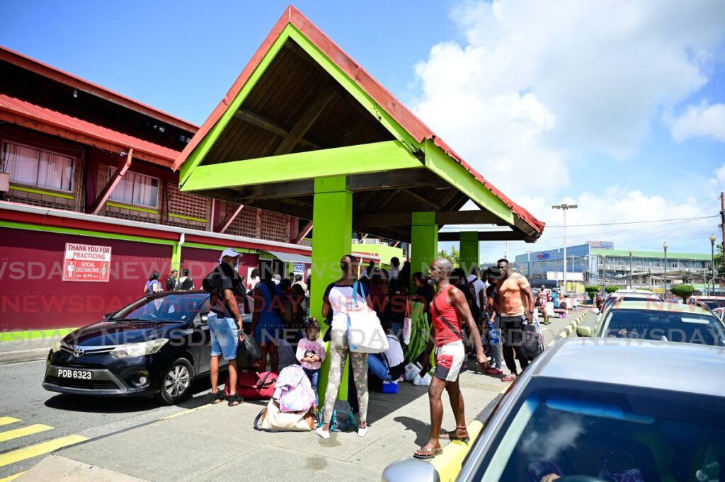 Passengers desperate to get to Trinidad at the Port of Scarborough on June 30 after the cancellation of sailing owing to Hurricane Beryl. - Photo by Visual Styles