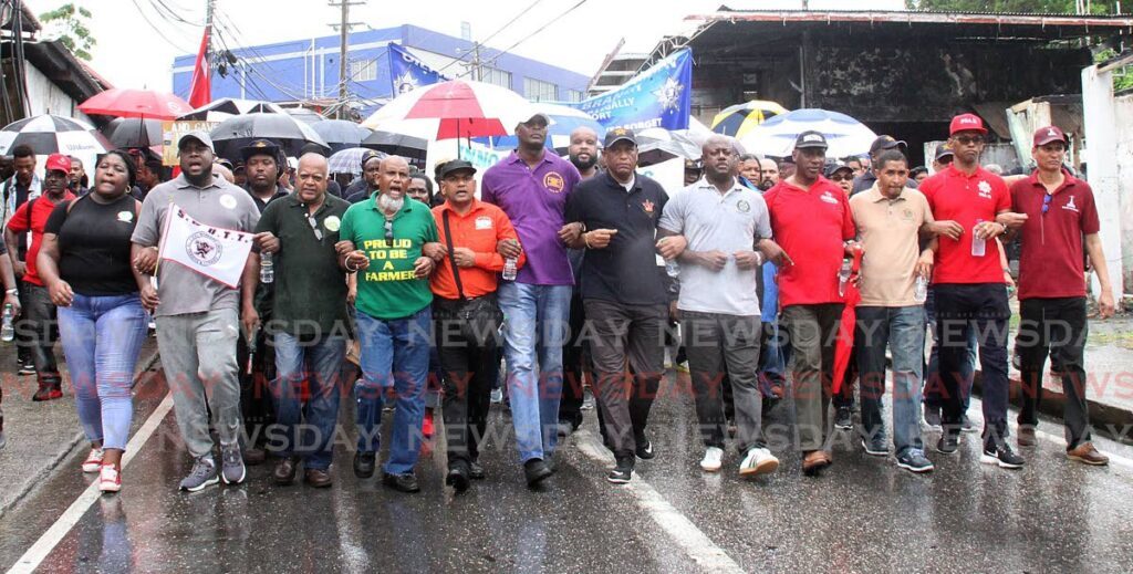 UNITY MARCH: Members of all the trade unions joined together, linking their arms, during the Labour Day march. - File photo