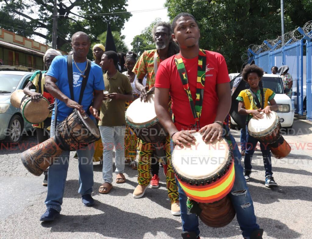 Members of the St James Cultural Artisan Drummers, Unified Cultural Beacons from Never Dirty Morvant, Frontline and Second Sea Scouts open for the festival at the Yoruba Village Drum Festival, on Piccadilly Street, Port of Spain  on June 15. - Photo by Faith Ayoung