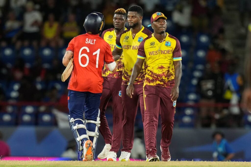 In this June 19 photo, England’s Phil Salt (L) is congratulated by West Indies players following their men’s T20 World Cup match at Darren Sammy National Cricket Stadium, Gros Islet, St Lucia. - AP PHOTO