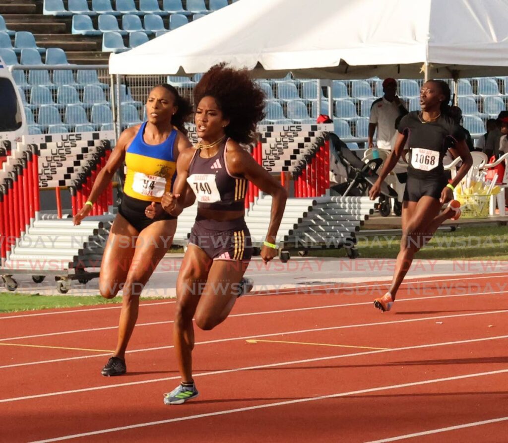 Simplex sprinter Sole Frederick, centre, on the way to victory in the women's 200m final at the NAAA National Championships.  - ROGER JACOB