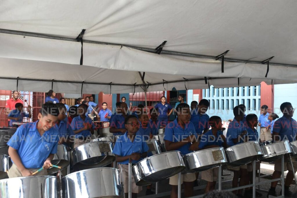 Pupils of St Margaret's Boys Anglican Primary School, Belmont, give a special performance at the school after receiving a donation of pan instruments from the East Port of Spain Development Company Ltd. - 