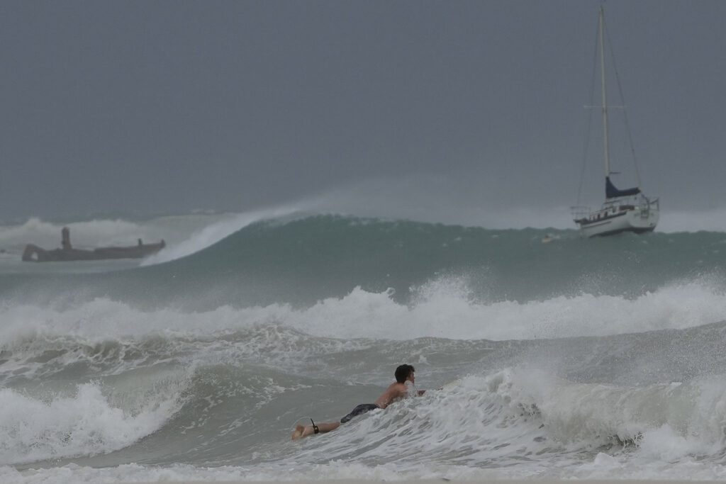 A surfer braves rough waves in Carlisle Bay as Hurricane Beryl passed through Barbados on July 1. - AP PHOTO 