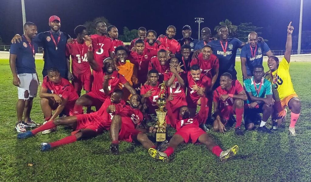 TTPFL tier two champions Harlem Strikers celebrate their 2-0 win over Defence Force in the final at the Arima Velodrome on June 29. Photo courtesy TTPFL.  - 