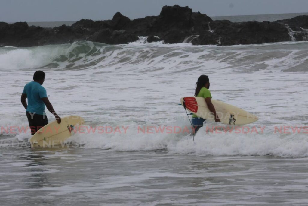 Surfers seek to take advantage of ideal conditions for their sport at San Souci Beach after the passage of Hurricane Beryl on July 1. - Photo by Roger Jacob 