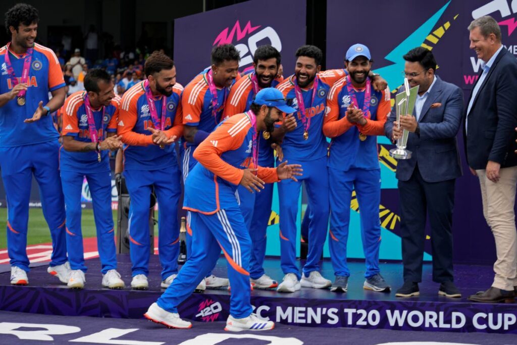 India's captain Rohit Sharma gestures playfully as he walks to collect the winners' after India won the ICC Men's T20 World Cup final match against South Africa at Kensington Oval in Bridgetown, Barbados, on June 29, 2024. - AP PHOTO