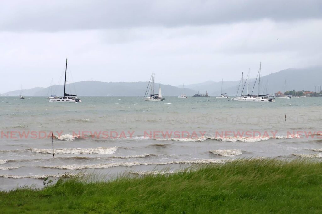 SAVE HAVEN: Several yachts anchored in the sea near the Foreshore, Port of Spain on Monday.  - Photo by Faith Ayoung