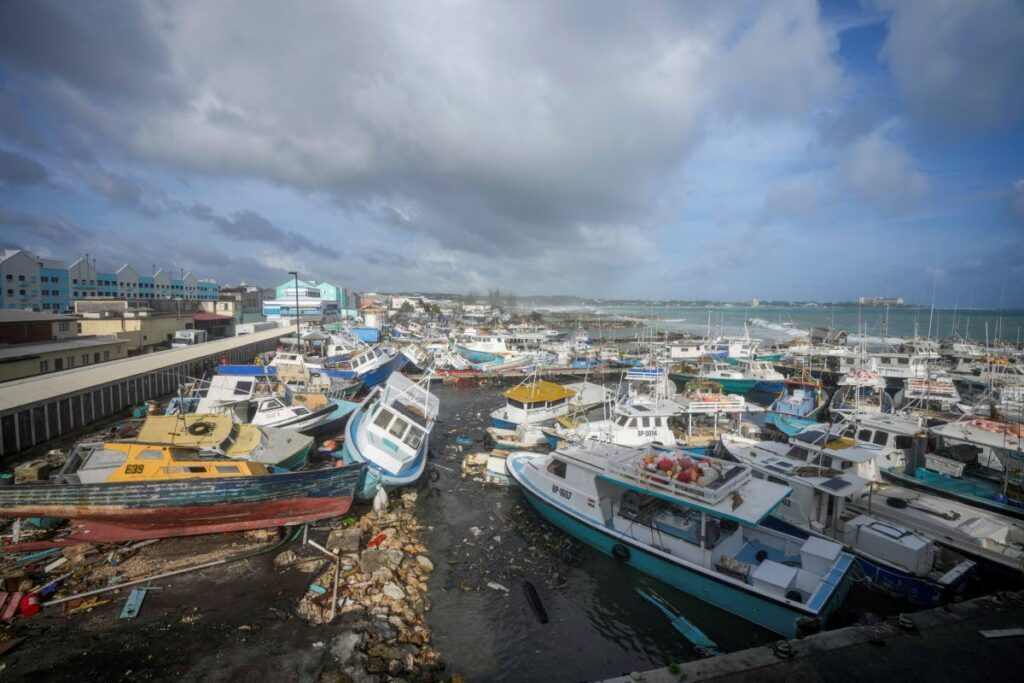 Fishing vessels lie damaged after Hurricane Beryl passed through the Bridgetown Fisheries in Barbados, on July 1. - AP PHOTO