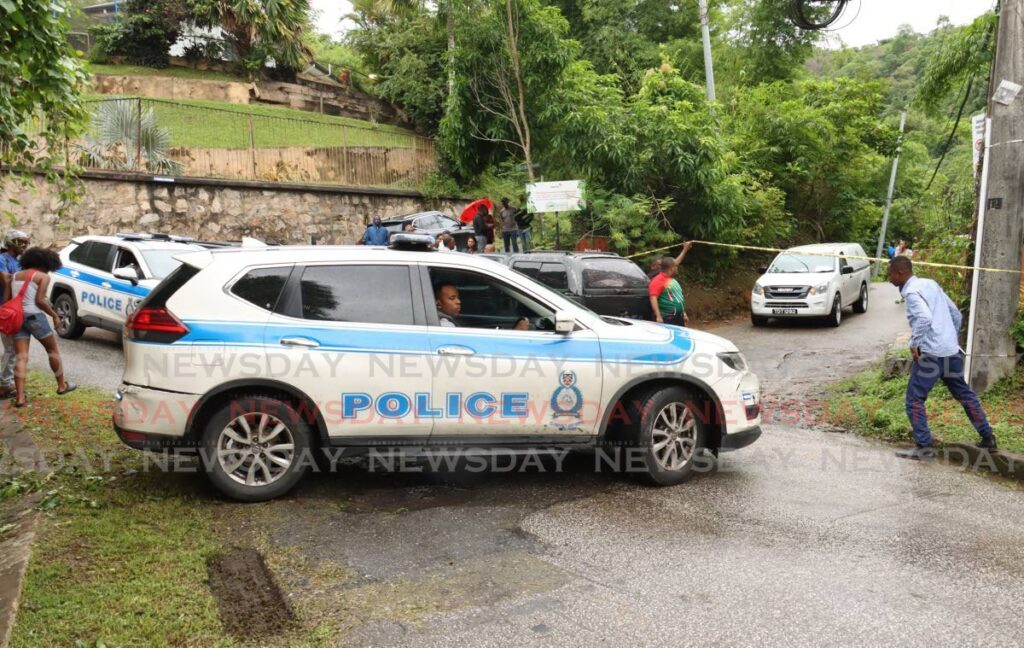 Police cordoned off Fondes Amandes Road, St Ann’s on July 3 after Che Mendez, a cigarette truck delivery driver, was shot dead by bandits. - Photo by Faith Ayoung