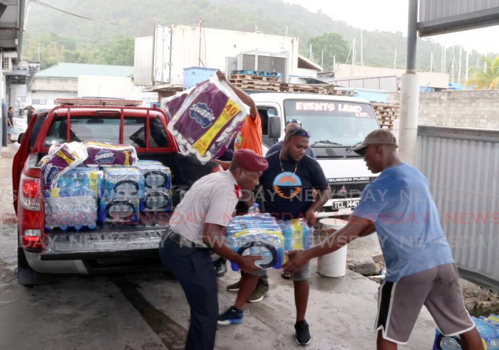 Fire officers from the Fire Prevention Unit Central Division dropped off relief supplies to the Heart of the Village Foundation in Chaguaramas to be shipped to Carriacou on July 3.  - Photo by Roger Jacob