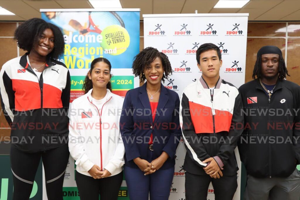 Tennis TT PRO Mignon, centre, with tennis players (from left) Alisha Alexis, Charlotte Ready, Tim Pasea, and Alijah Leslie during the Summer of Tennis launch at the National Racquet Centre, Tacarigua, July 5. - Photo by Ayanna Kinsale