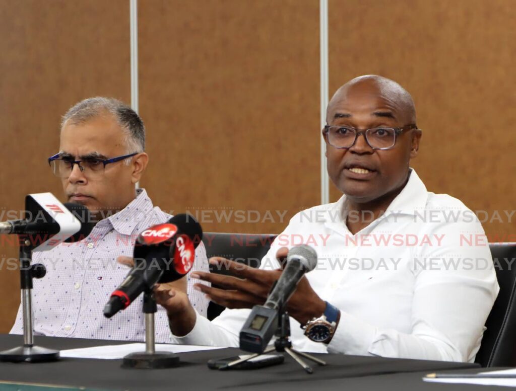 TennisTT president Hayden Mitchell, right, speaks during the Summer of Tennis launch at the National Racquet Centre, Tacarigua.