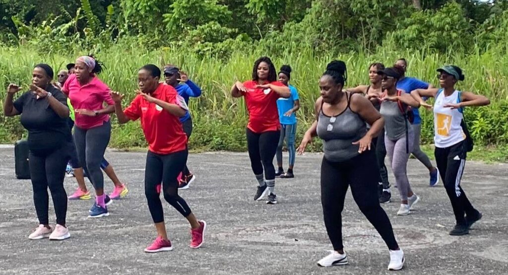 ERHA staff and family take part in an aerobics session in Chaguaramas last Saturday. 