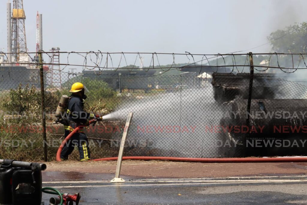 A firefighter attempts to put out a fire. 
 - File photo by Faith Ayoung