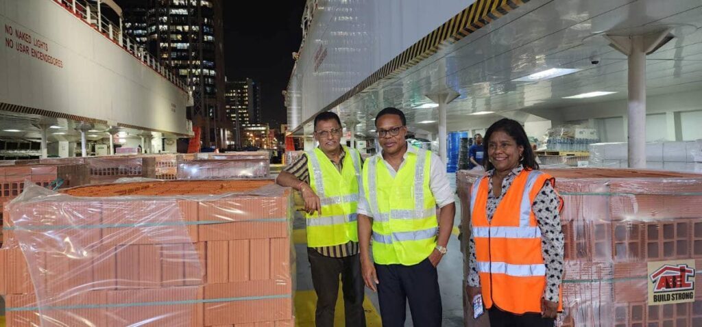 Minister of Works and Transport Rohan Sinanan, Minister of Foreign and Caricom Affairs Dr Amery Browne and Paula Gopee-Scoon, Minister of Trade and Industry, at the loading of the Galleons Passage at the GSS Ferry Jetty, Port of Spain on July 5. The cargo vessel departed at 1 am on July 6 for Grenada to deliver relief supplies. - 