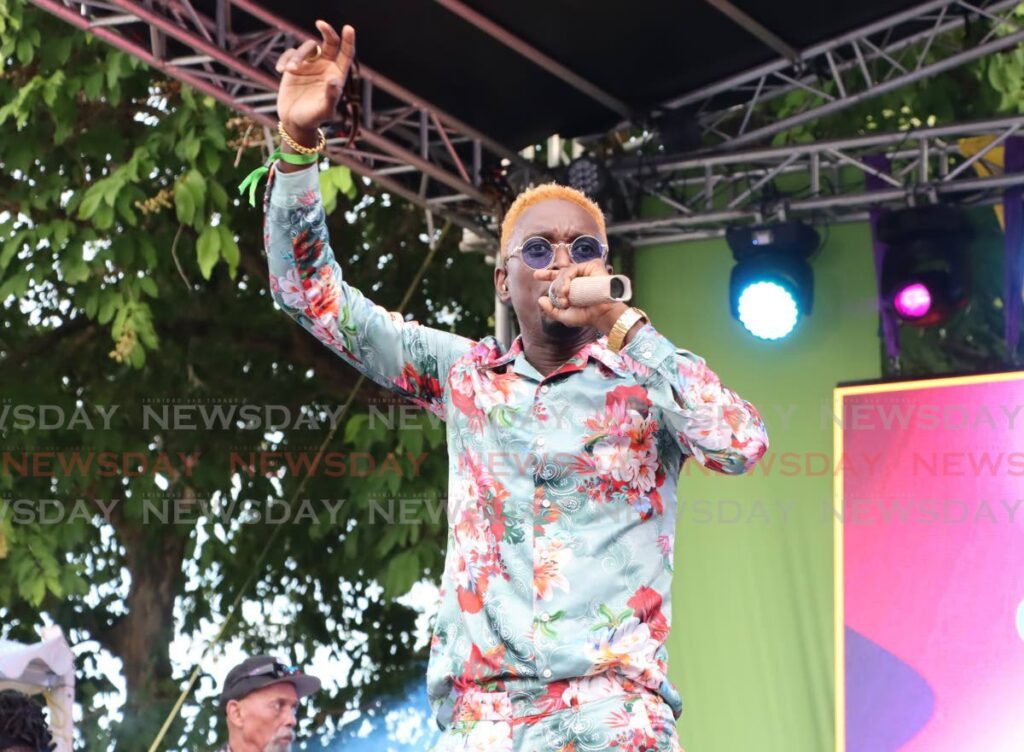 Soca artiste College Boy Jesse performs during UWI Garden Party on July 7.