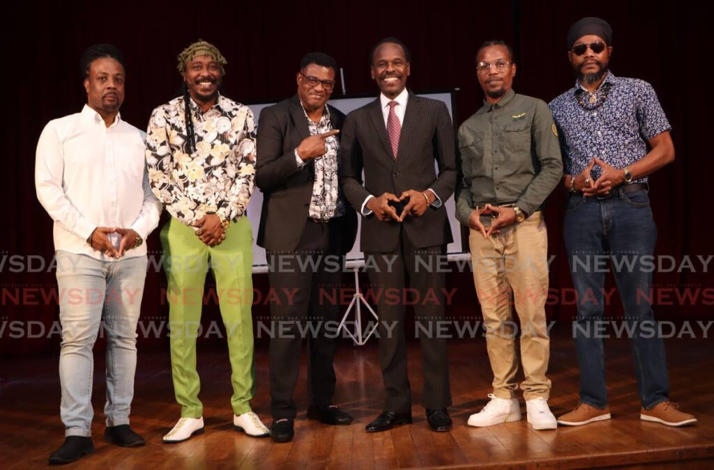 NEW APPROACH: Minister of National Security Fitzgerald Hinds, fourth from left, is flanked by entertainers Ziggy Rankin, Isasha, Mr King, King David and Prophet Benjamin at the launch of the Call To Order anti-crime initiative by the Ministry of National Security, at City hall, Port of Spain on Monday. - Photo by Angelo Marcelle