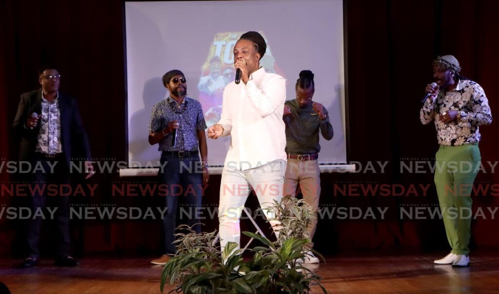 Entertainer Ziggy Rankin sings his verse in the hit song The Call, alongside fellow artistes Mr King, Prophet Benjamin, King David and Isasha, at the launch of the Call To Order initiative by the Ministry of National Security, at City hall, port of Spain on Monday.  - Angelo Marcelle