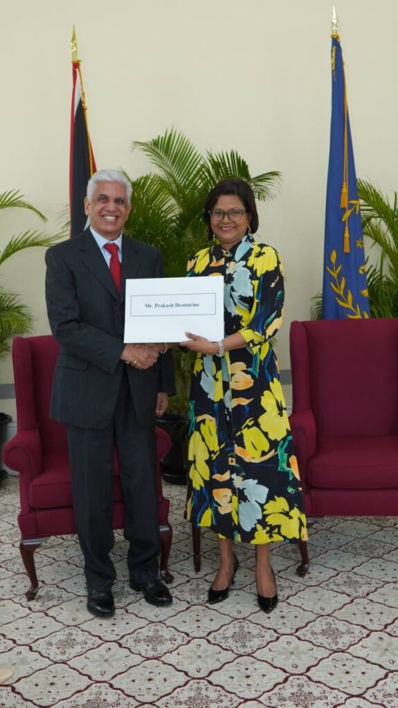 President Christine Kangaloo congratulates Prakash Deonarine SC on his appointment to the inner bar on July 10 at President's House, St Ann's.   - Photo courtesy Office of the President