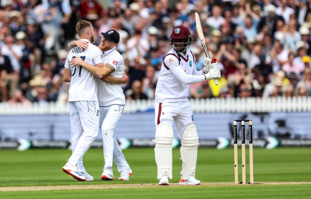 England's Gus Atkinson, left, celebrates the wicket of West Indies batsman Shamar Joseph with Ben Stokes on day one of the first Rothesay Men's Test match at Lord's Cricket Ground, London, on Wednesday. AP PHOTO - 