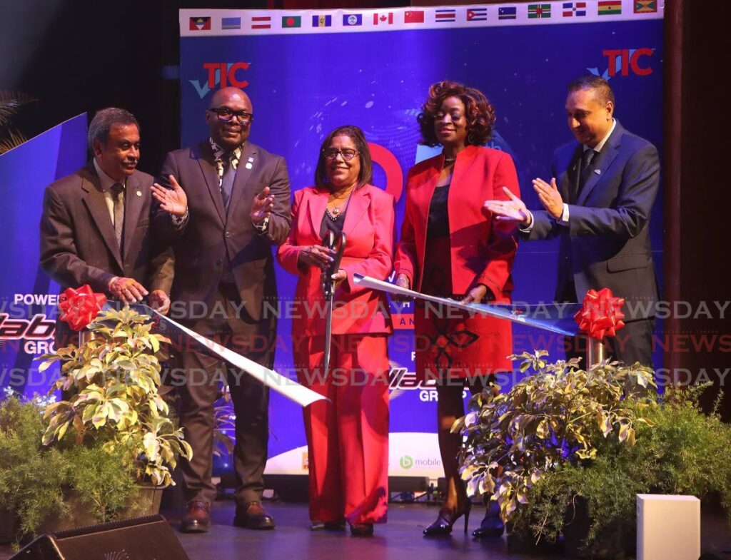 RIBBON CUTTING: TTMA director Rudy Rampersad, left, TTMA president Roger Roach, Trade Minister Paula Gopee-Scoon, Minister of Social Development Donna Cox and EximBank CEO Navin Dookeran, cut the ribbon to officially open TIC 2024 at Queen's Hall, St Anns on July 11.  - Photo by Angelo Marcelle