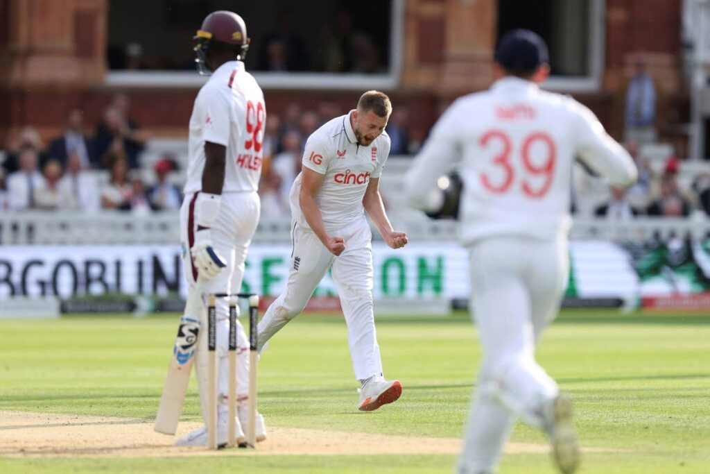 England's Gus Atkinson (C) celebrates taking the wicket of West Indies' Jason Holder on day two of the first Test at Lord's Cricket Ground, London, on July 11, 2024. - AP PHOTO